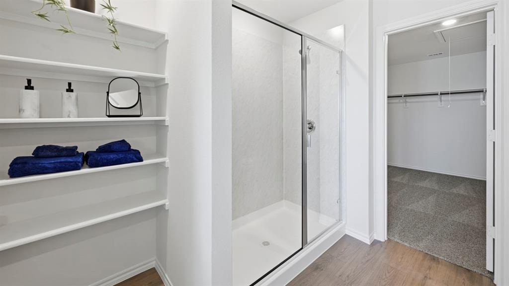3427 Spur Run Sherman, TX 75090 - Photo 5 of 36 a view of walk in closet with clothes and shoes