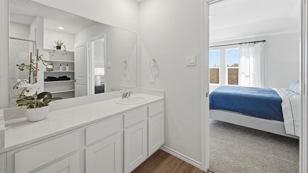 3427 Spur Run Sherman, TX 75090 - Photo 7 of 36 a bedroom with a bed and a sink