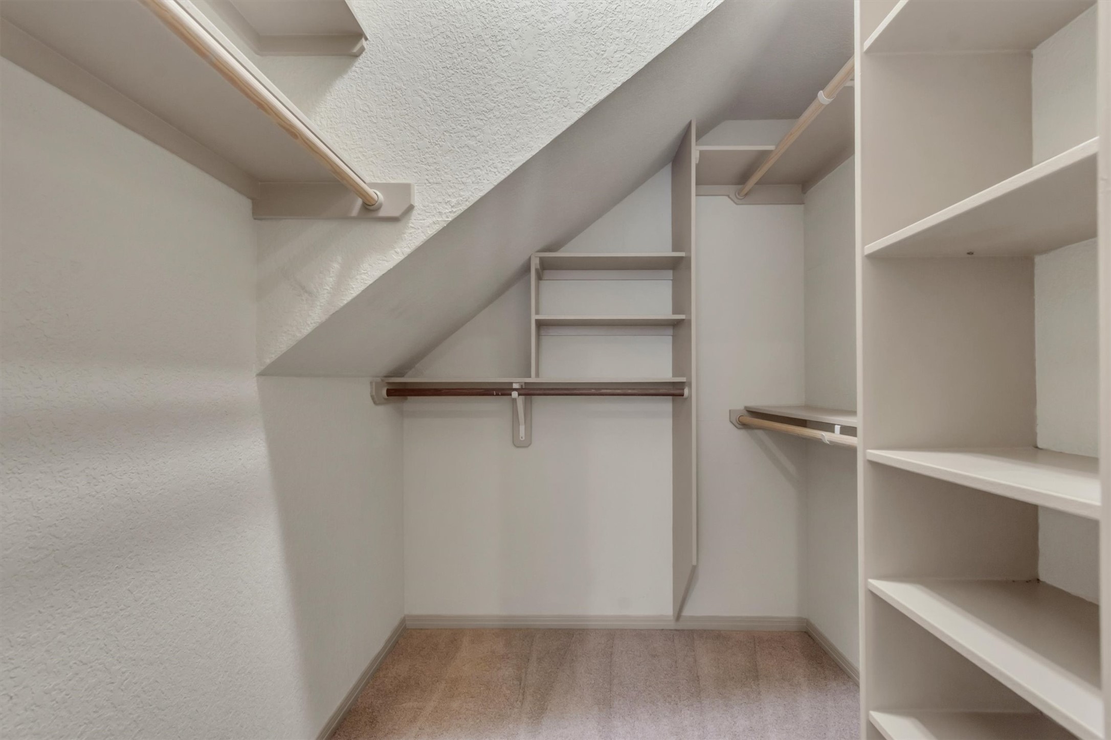 6008 Tributary Ridge Court Austin, TX 78759 - Photo 18 of 36 The 2nd primary closet. Ample shelving and hanging rods maximize storage in this well-appointed primary closet.