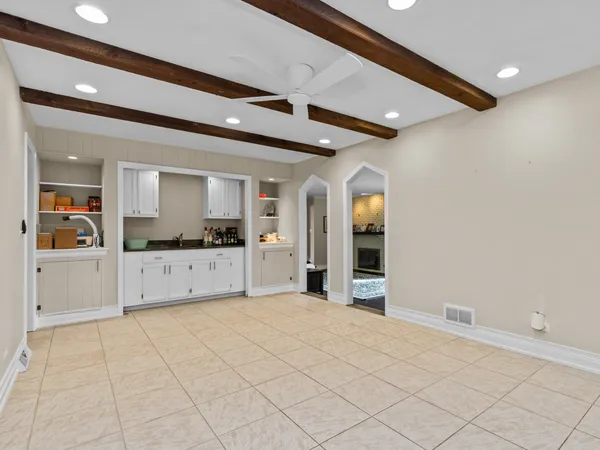 a view of a kitchen with cabinet and window