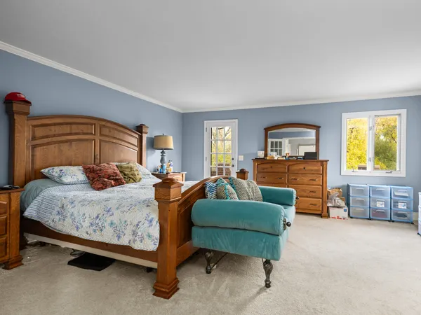 a bedroom with a bed and a couch