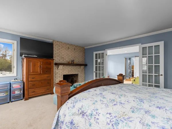 a bedroom with a bed and dresser