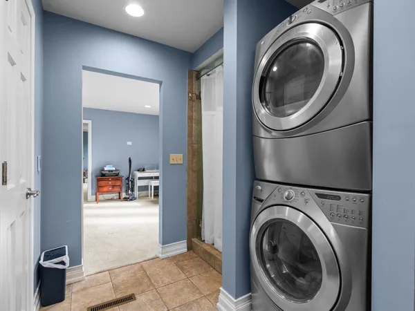 a view of a hallway with washer and dryer