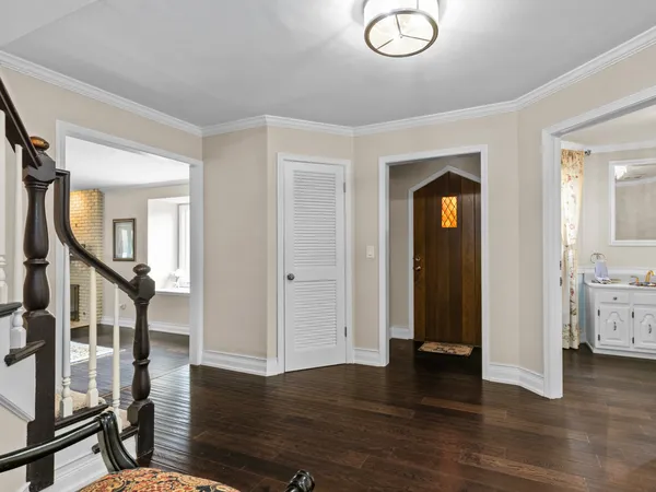 wooden floor with fireplace and windows in a room