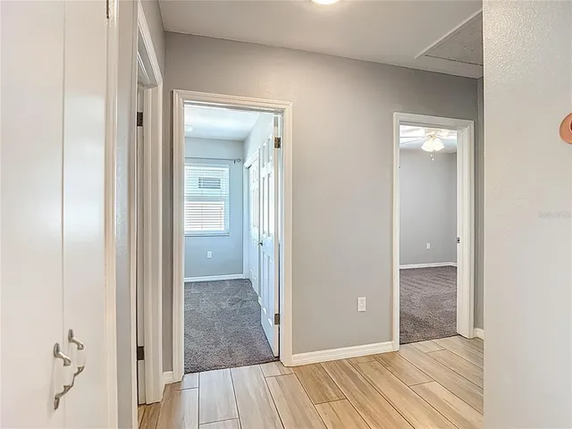 a view of a bathroom from a hallway