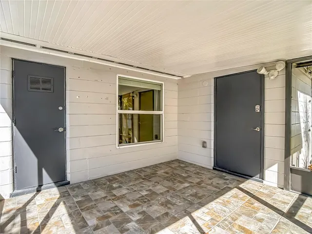 a view of an empty room and window