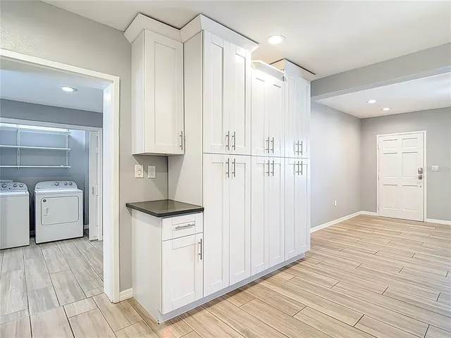 a kitchen with granite countertop a sink and a stove top oven
