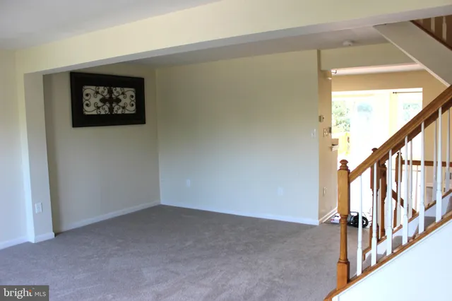 a view of a hallway with stairs