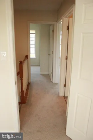 a view of a hallway with front door