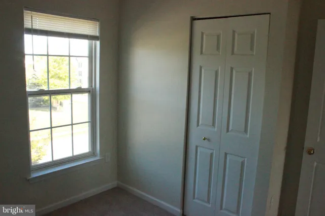 a front view of a building with a lot of windows