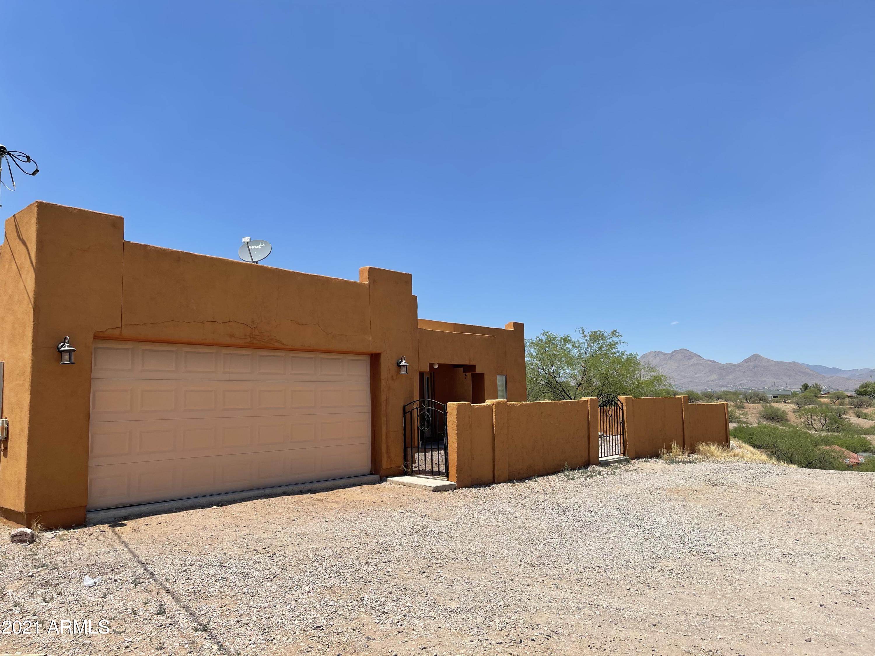 1022 Circulo Golondrina, Unit B Rio Rico, AZ 85648 - Photo 1 of 20 a view of a house with a snow in the background