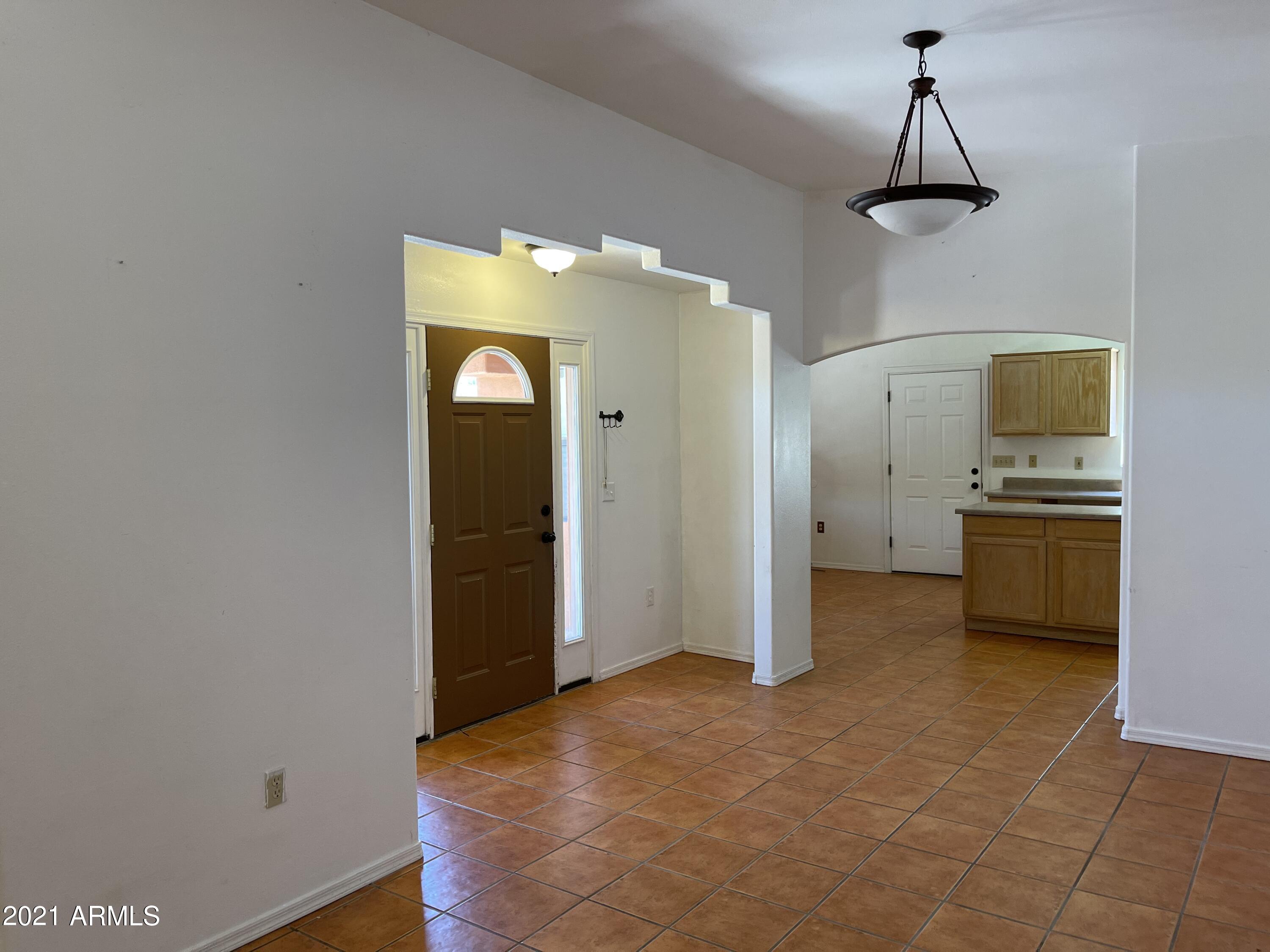 1022 Circulo Golondrina, Unit B Rio Rico, AZ 85648 - Photo 11 of 20 a view of a kitchen with a sink cabinets and wooden floor