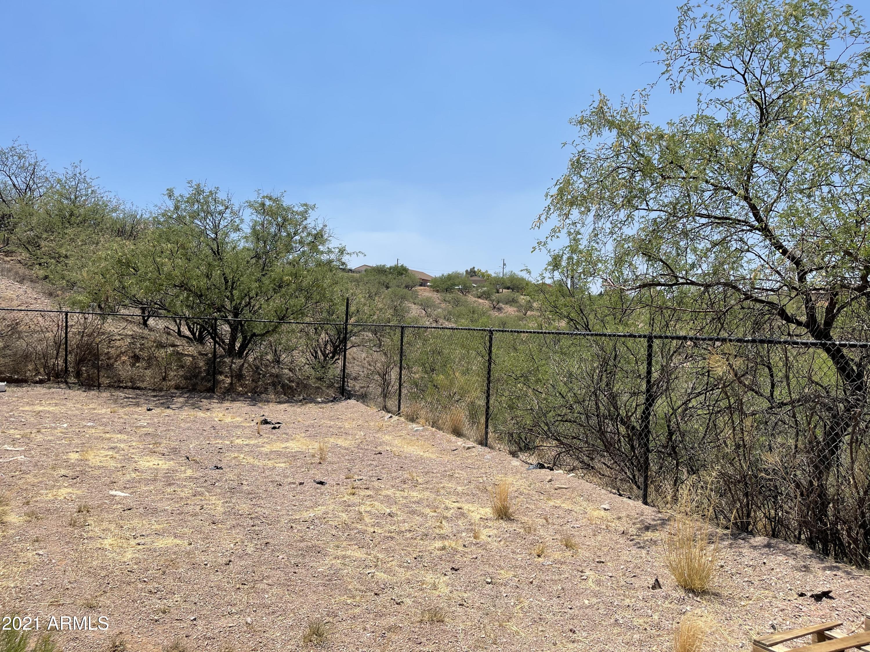 1022 Circulo Golondrina, Unit B Rio Rico, AZ 85648 - Photo 19 of 20 a street view with mountain view