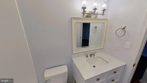 a bathroom with a sink and toilet