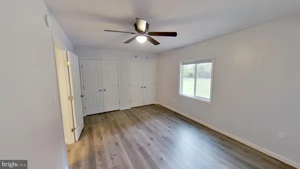 a view of front door with wooden floor