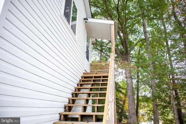 a backyard of a house with oven and trees