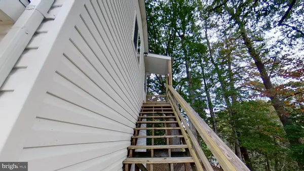 a view of balcony with wooden floor