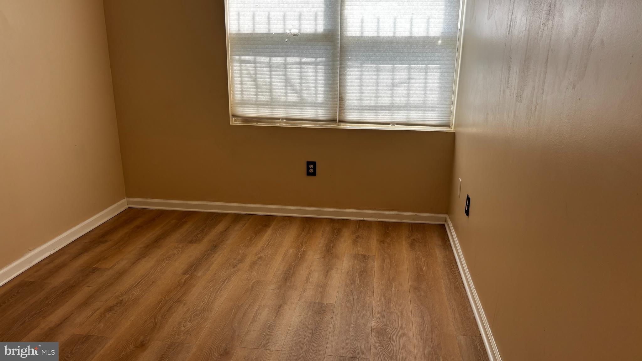 1240 18th Street Northeast, Unit 2 Washington, DC 20002 - Photo 6 of 11 a view of a room with wooden floor and windows