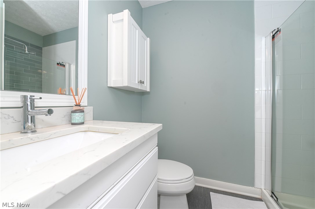 1688 Sheridan Road South Euclid, OH 44121 - Photo 34 of 48 Bathroom featuring walk in shower, vanity, and toilet