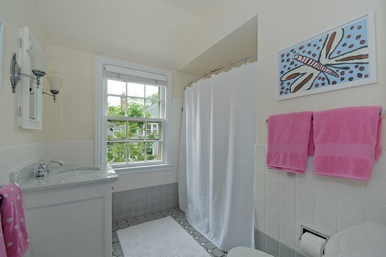 590 Sheridan Road Winnetka, IL 60093 - Photo 14 of 16 a bathroom with a sink and a mirror