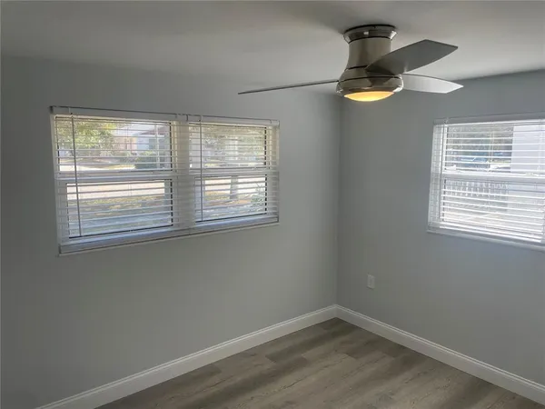a view of an empty room with a window