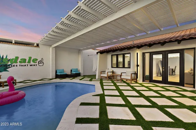 a view of a swimming pool with a patio