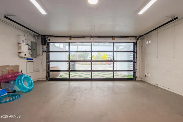 a kitchen with granite countertop white cabinets white appliances and a sink