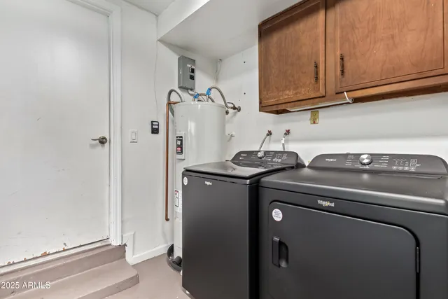 a bathroom with double vanity sink and a mirror