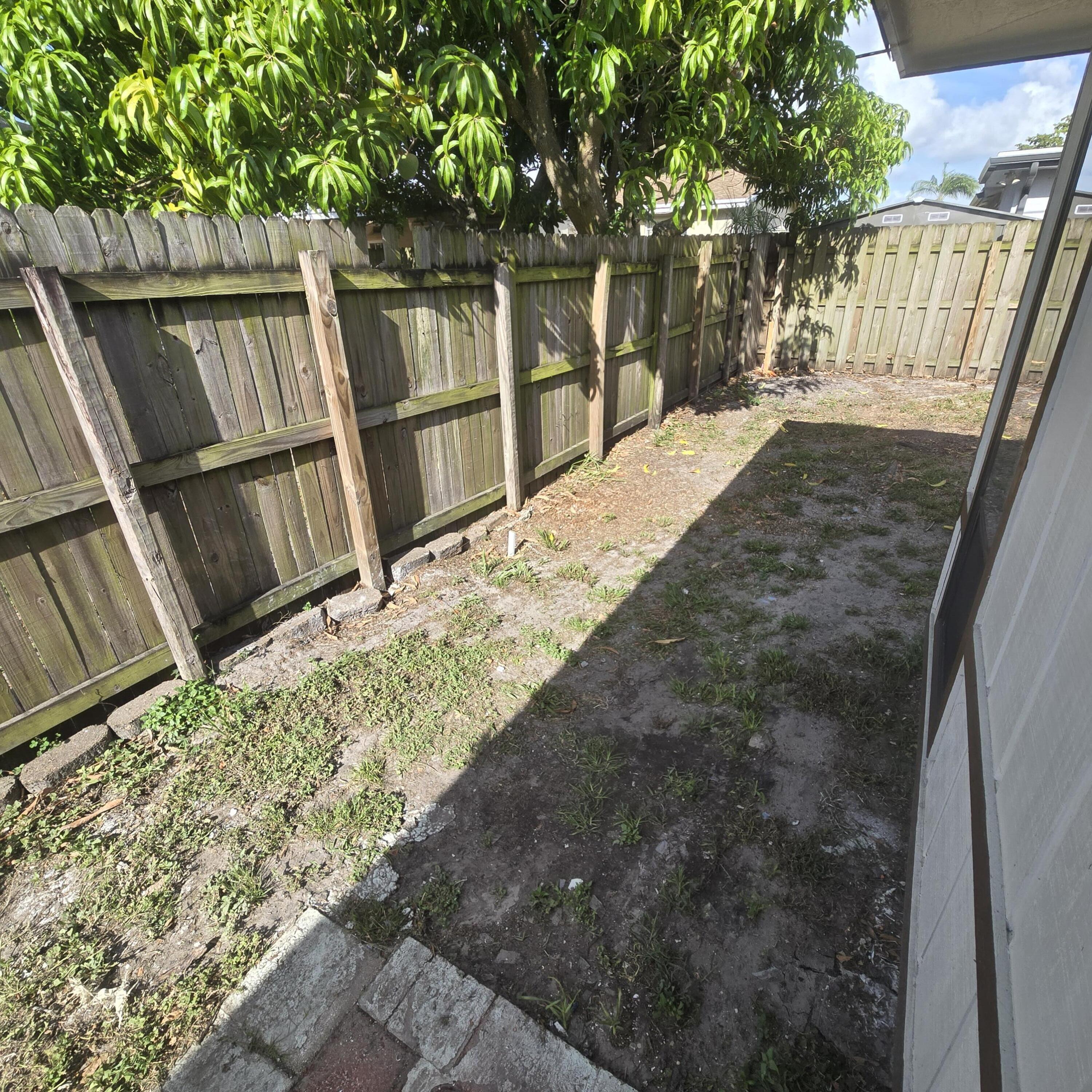 1237 Wynnedale Road, Unit 1237 West Palm Beach, FL 33417 - Photo 15 of 20 a view of backyard of the house