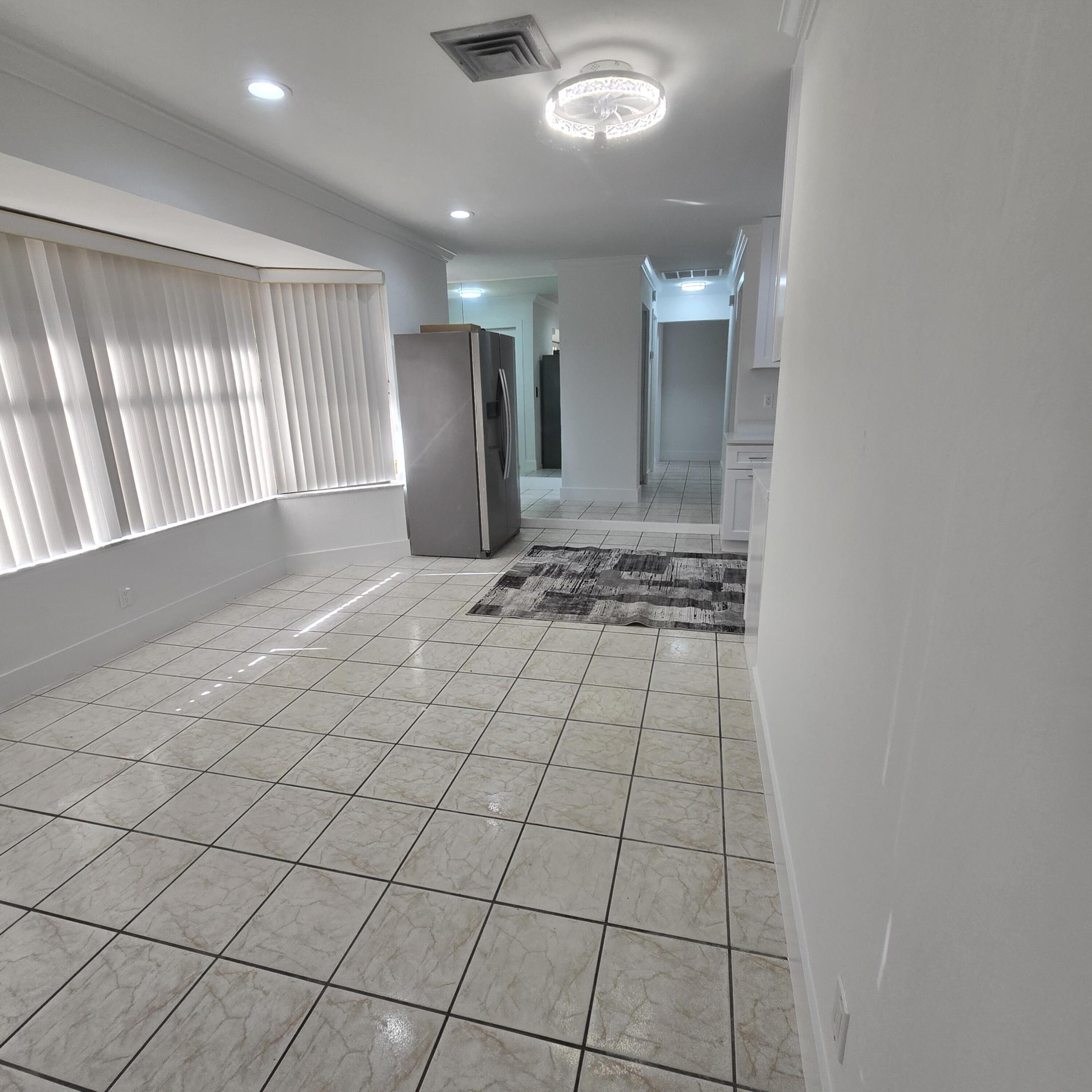 1237 Wynnedale Road, Unit 1237 West Palm Beach, FL 33417 - Photo 6 of 20 a view of an empty room and window