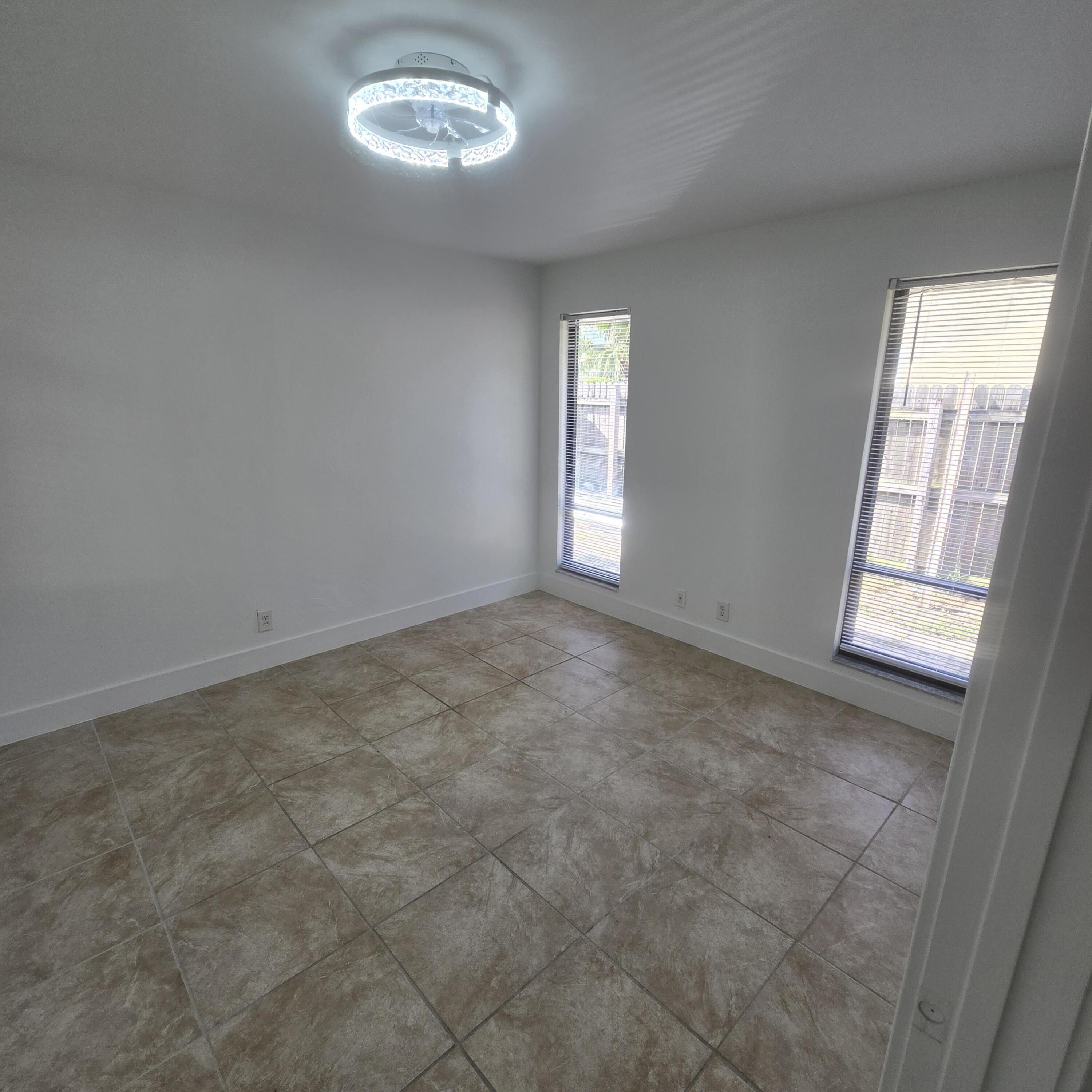 1237 Wynnedale Road, Unit 1237 West Palm Beach, FL 33417 - Photo 10 of 20 a view of empty room with window