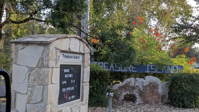 a view of a wooden door and sign board
