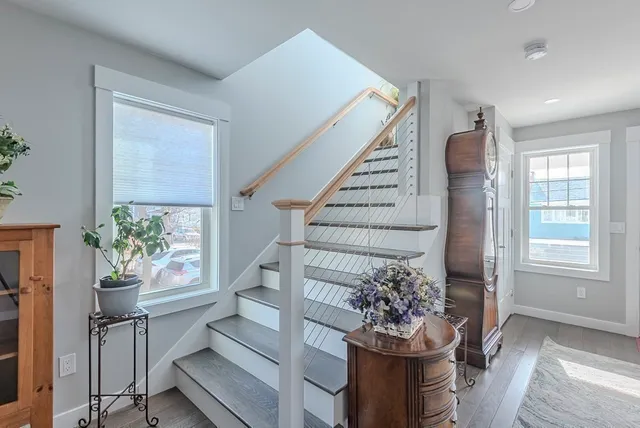 a kitchen with stainless steel appliances granite countertop a refrigerator a stove and a refrigerator