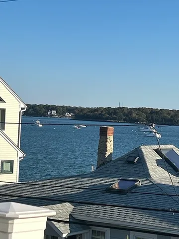 a kitchen with granite countertop a stove top oven sink and cabinets