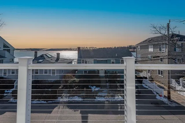 a bathroom with a sink toilet and mirror