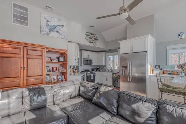 a bathroom with a granite countertop sink mirror and shower