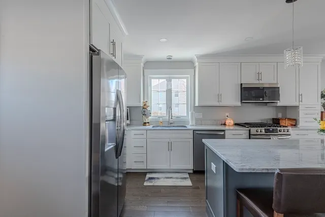 a bed room with two beds and a chandelier
