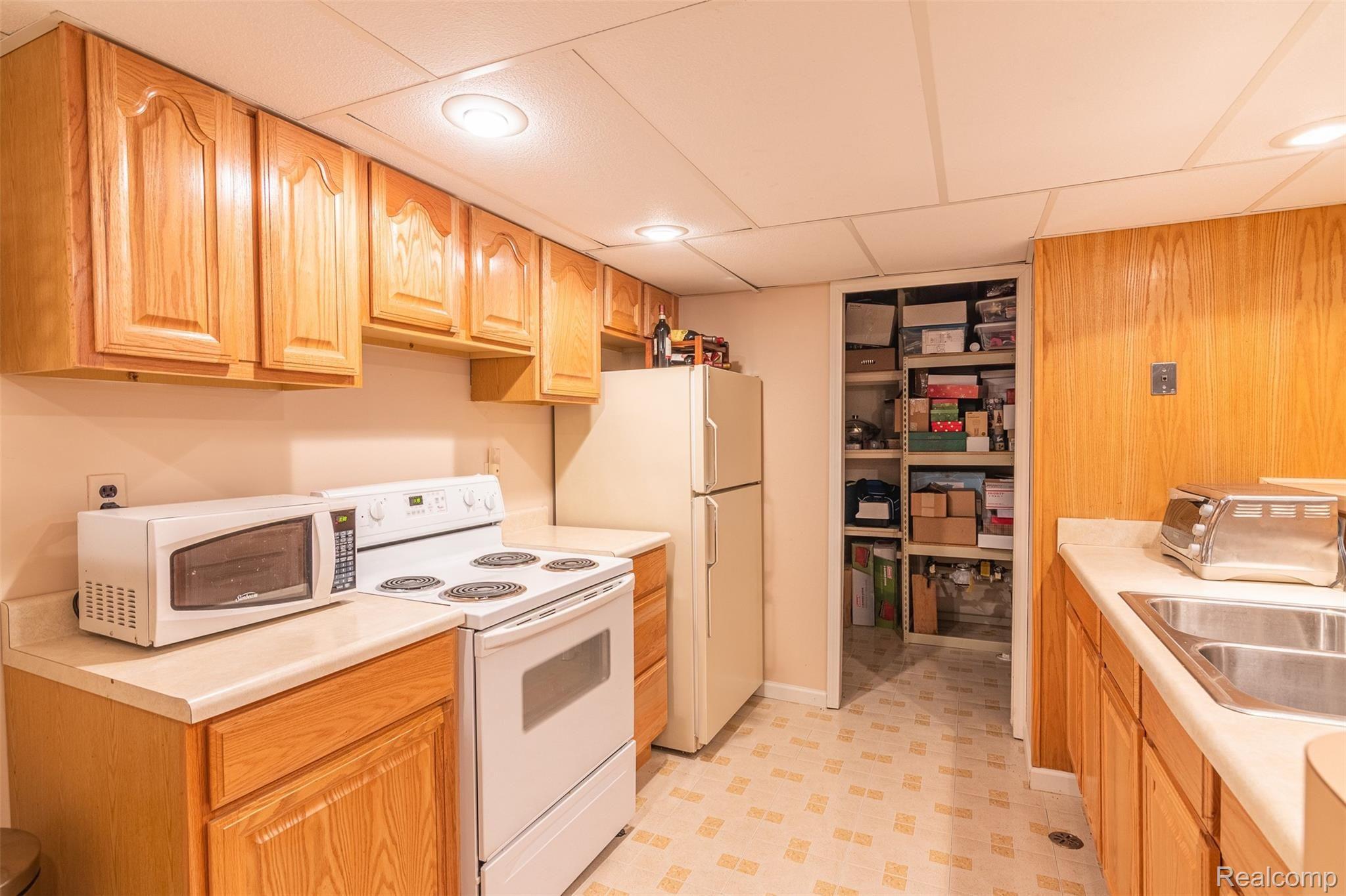 351 Silvervale Drive Rochester, MI 48309 - Photo 40 of 49 Basement kitchen and storage