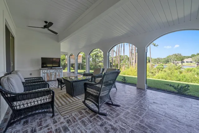 a living room with furniture and stairs