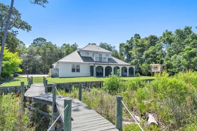 a very nice looking kitchen with a large window stainless steel appliances and kitchen view