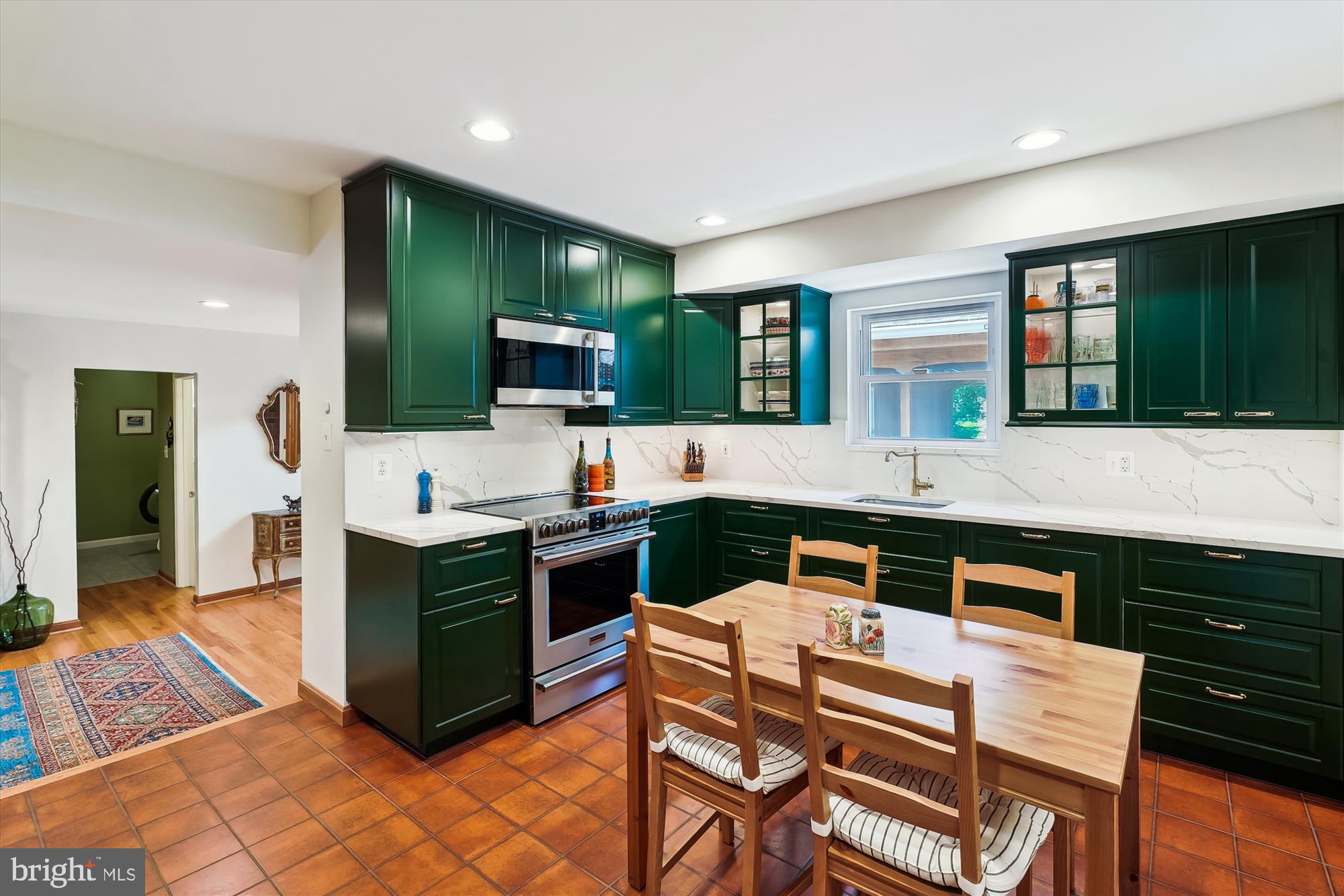 8510 Oakford Drive Springfield, VA 22152 - Photo 11 of 36 a kitchen with a stove and a microwave