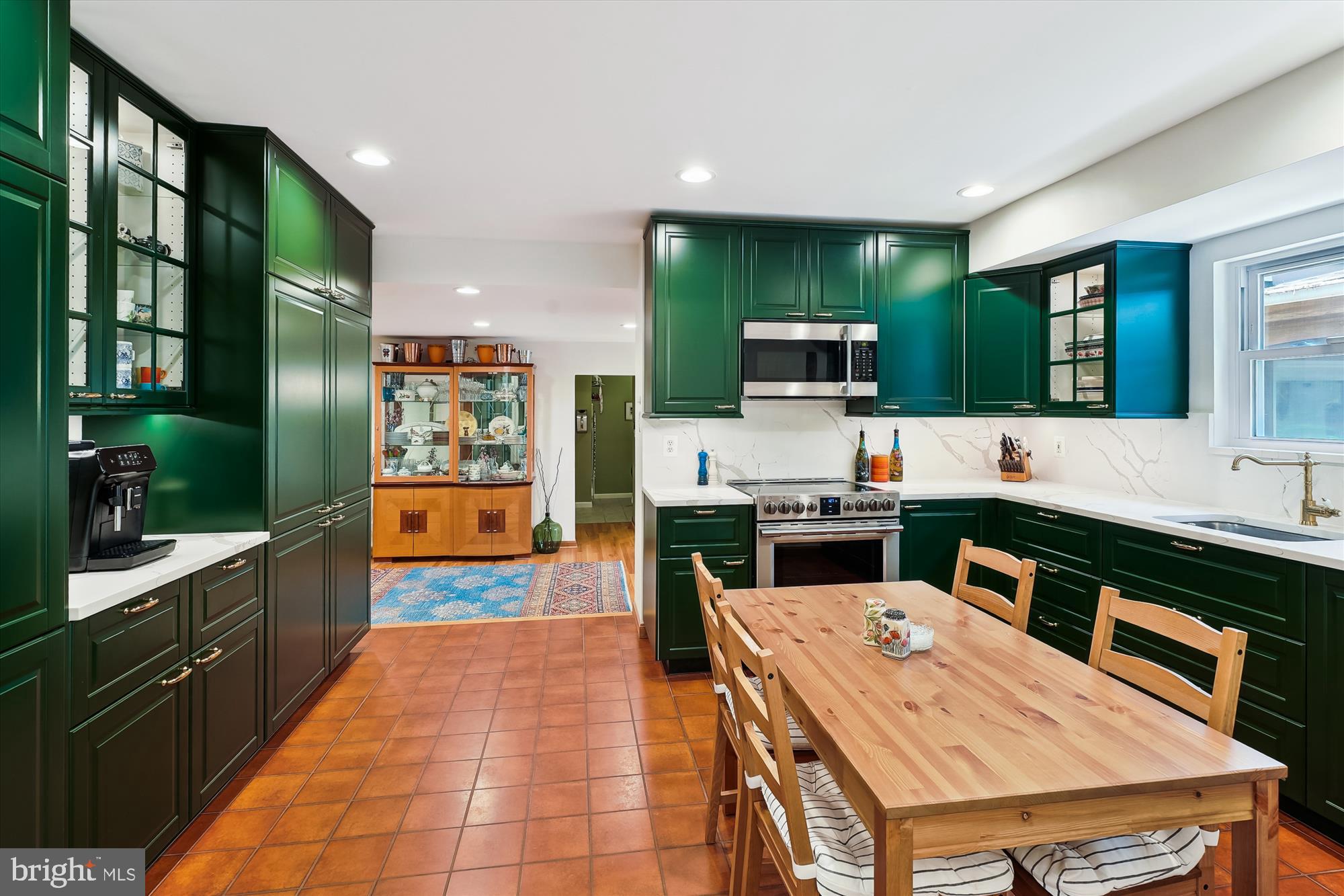 8510 Oakford Drive Springfield, VA 22152 - Photo 12 of 36 a large kitchen with stainless steel appliances wooden cabinets a stove and a center island