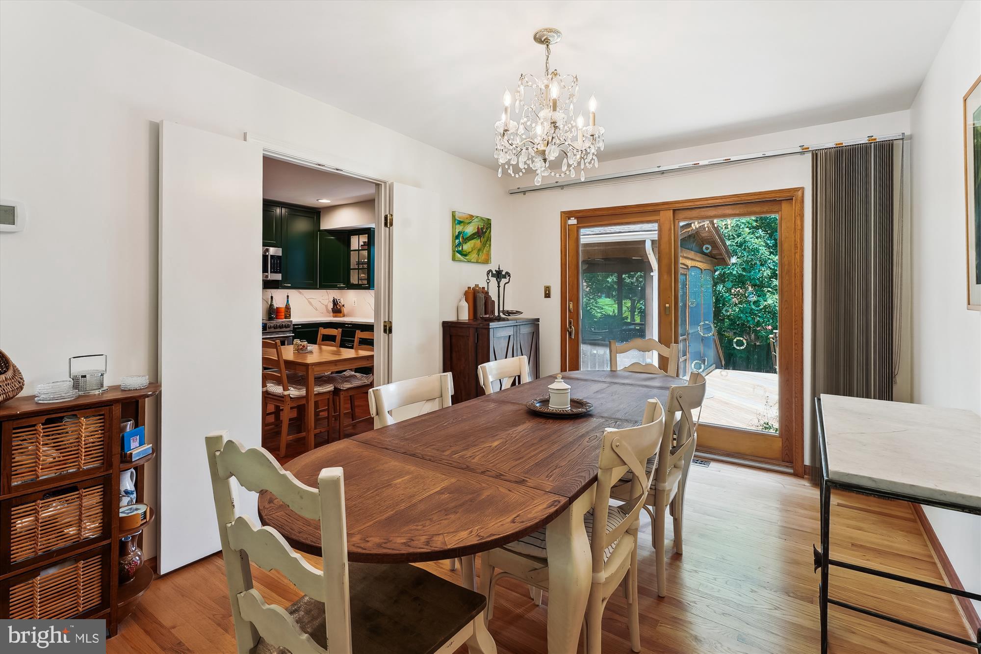 8510 Oakford Drive Springfield, VA 22152 - Photo 13 of 36 a view of a dining room with furniture window and wooden floor