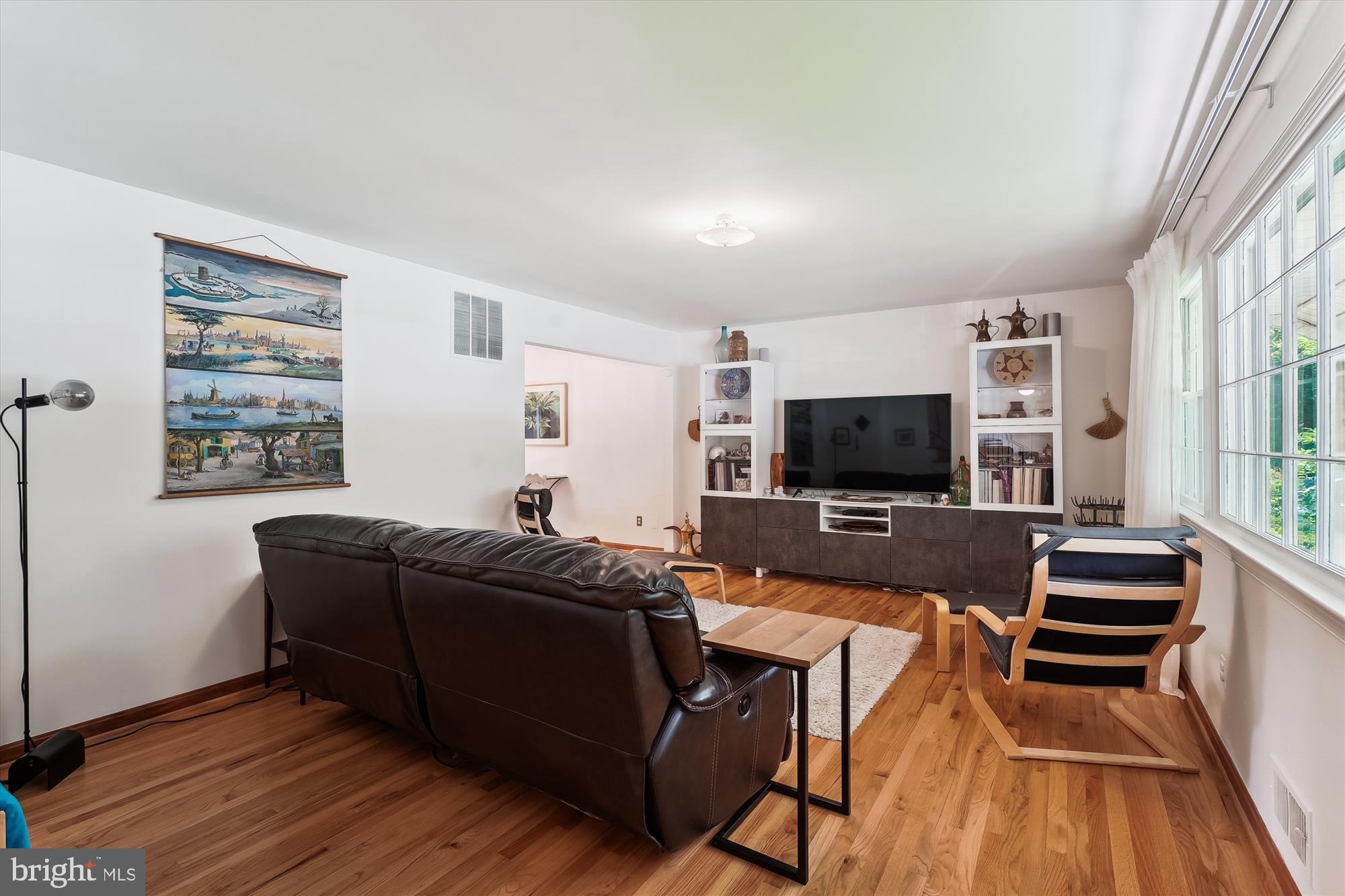 8510 Oakford Drive Springfield, VA 22152 - Photo 16 of 36 a living room with furniture and a flat screen tv