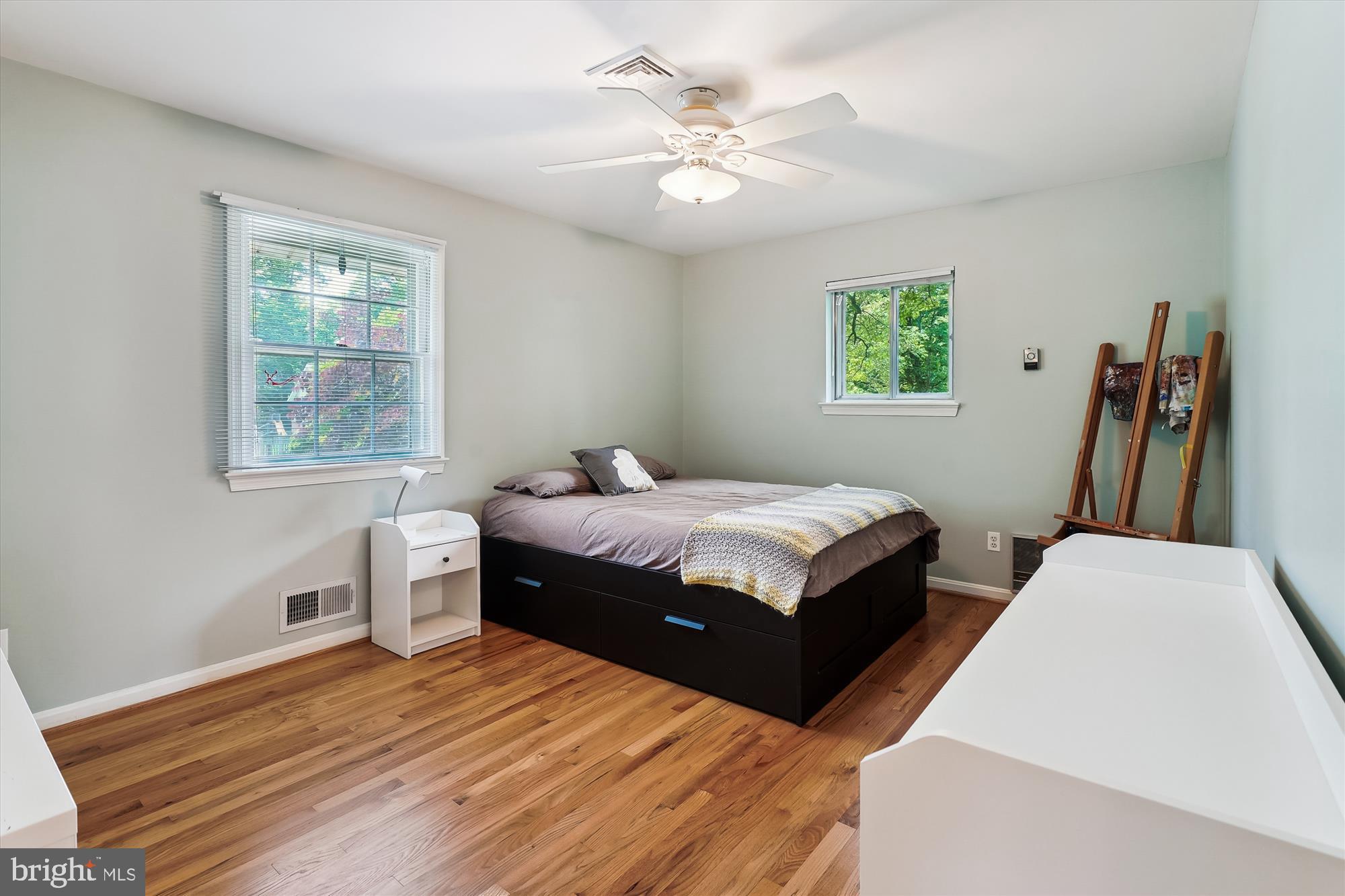 8510 Oakford Drive Springfield, VA 22152 - Photo 23 of 36 a bedroom with a bed wooden floor and window