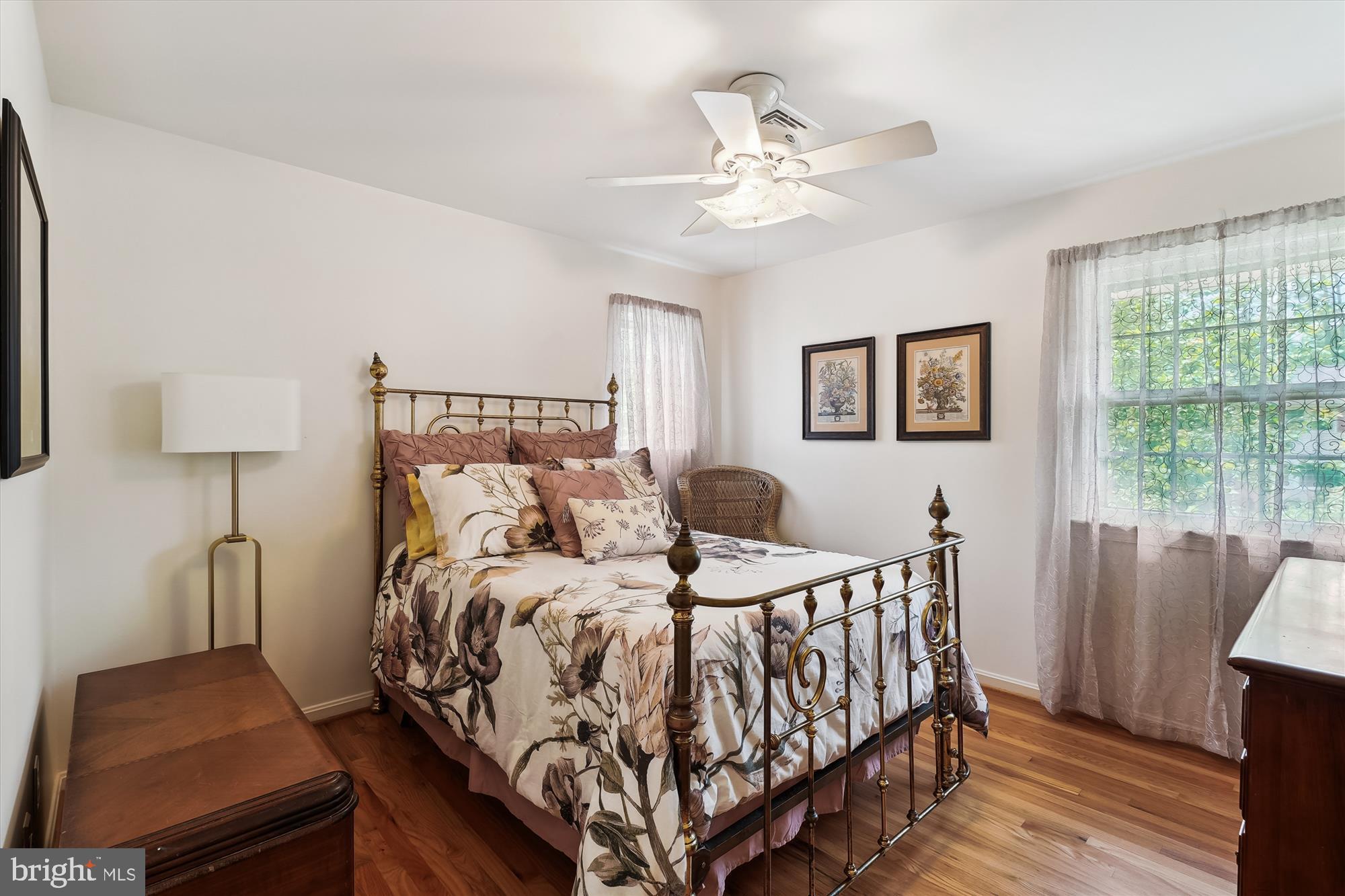 8510 Oakford Drive Springfield, VA 22152 - Photo 24 of 36 a bedroom with a bed and wooden floor