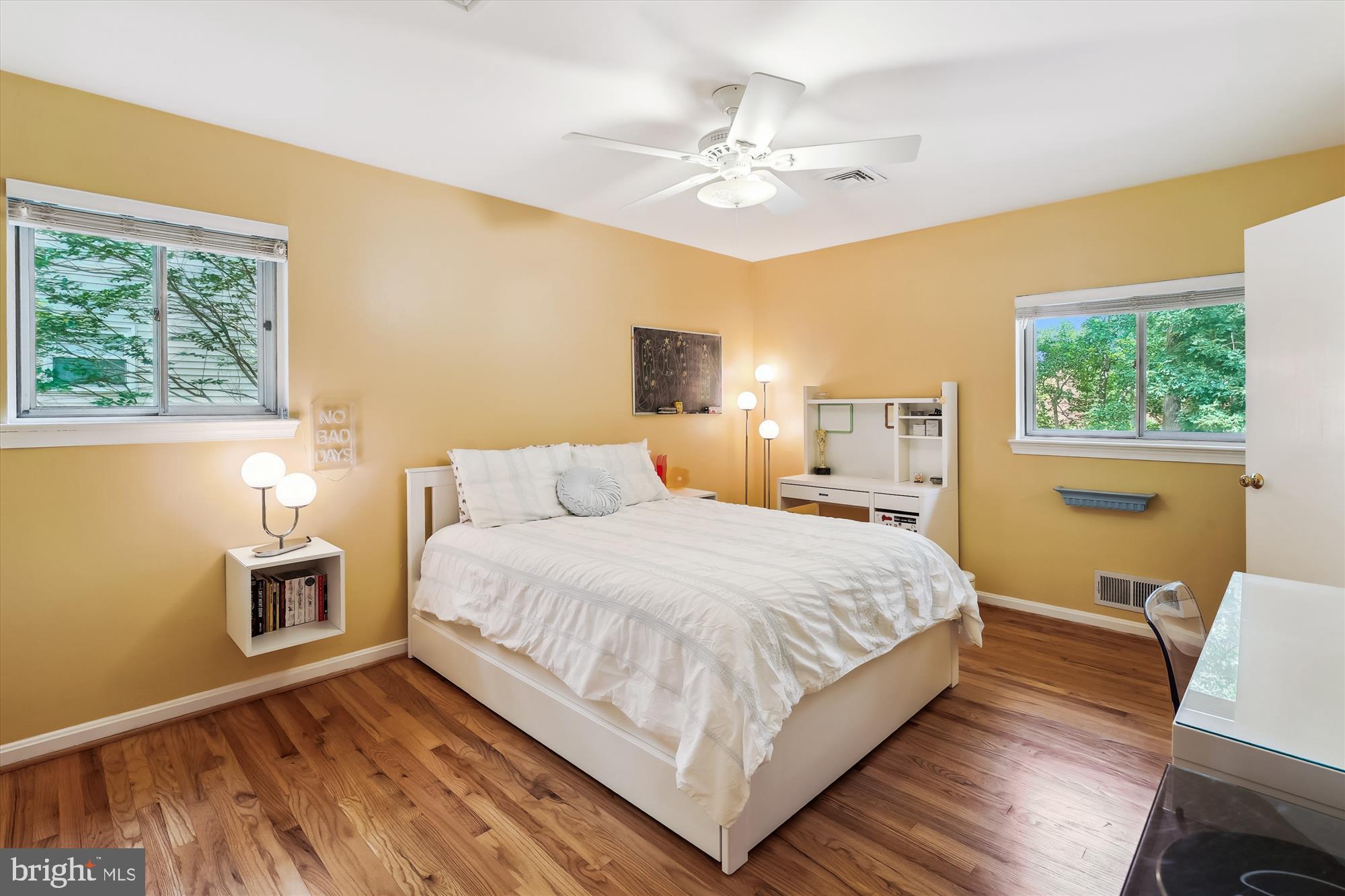 8510 Oakford Drive Springfield, VA 22152 - Photo 25 of 36 a bedroom with a large bed a chandelier and dresser