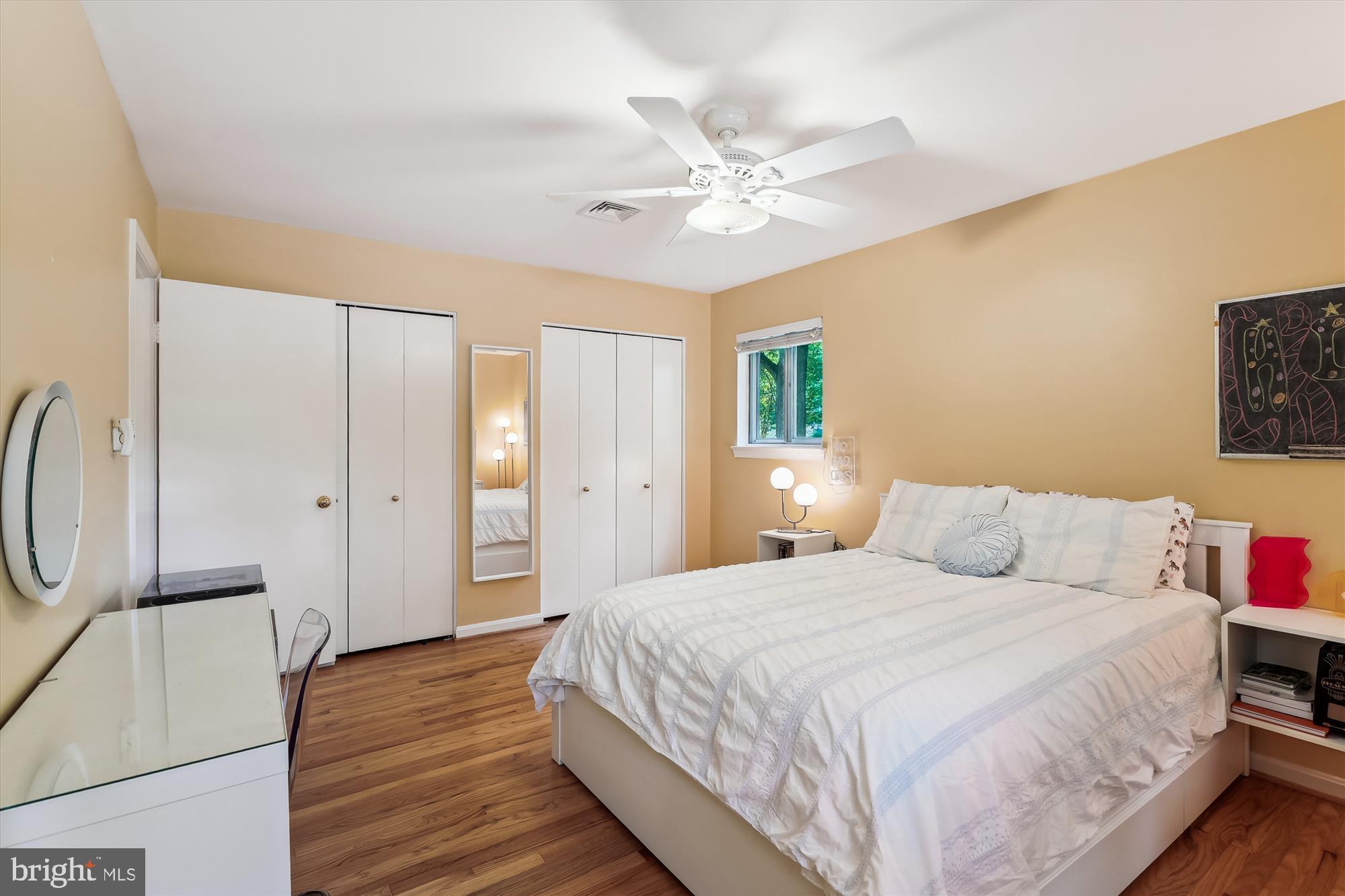 8510 Oakford Drive Springfield, VA 22152 - Photo 26 of 36 a bedroom with a bed and a chandelier