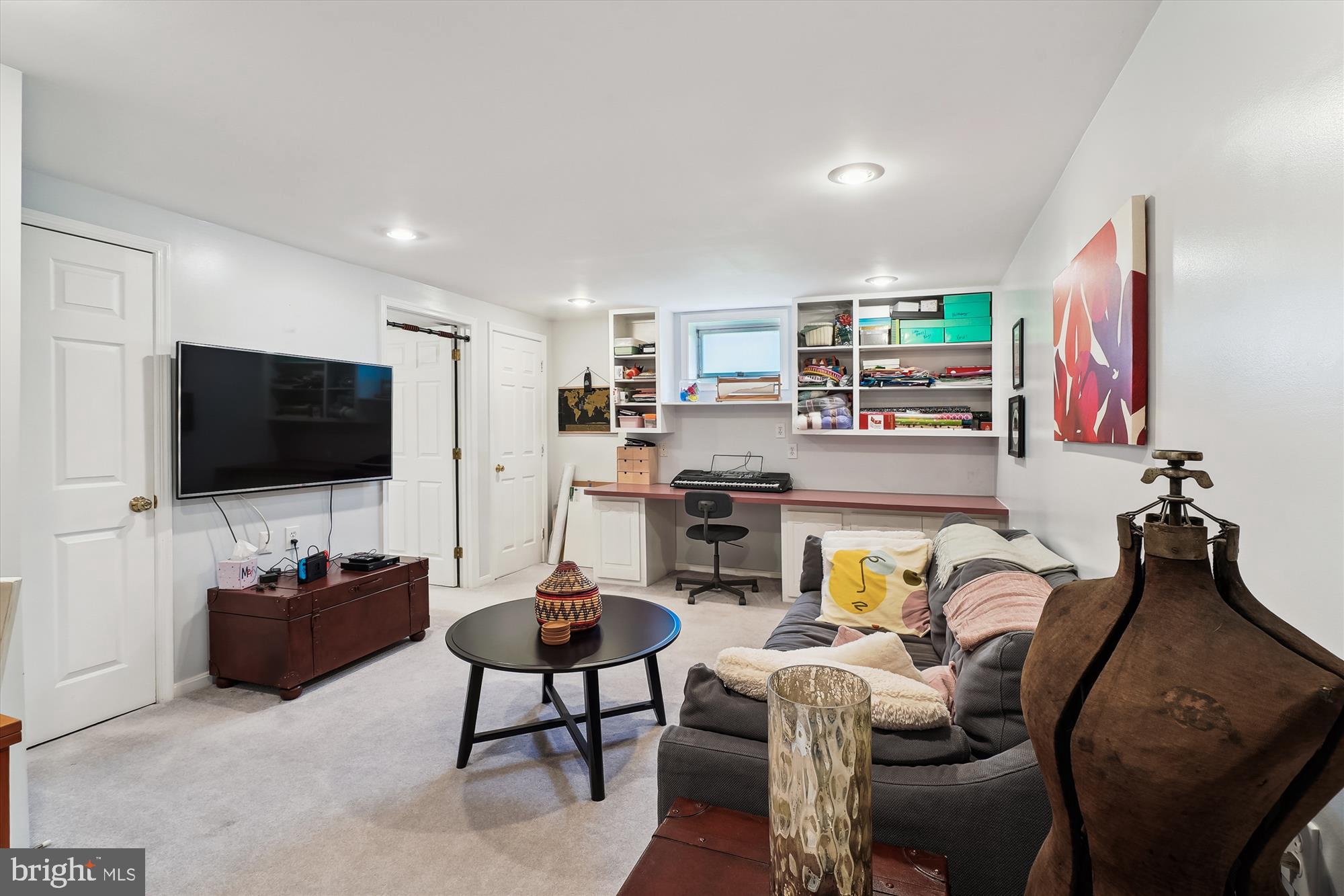 8510 Oakford Drive Springfield, VA 22152 - Photo 31 of 36 a living room with furniture and a flat screen tv