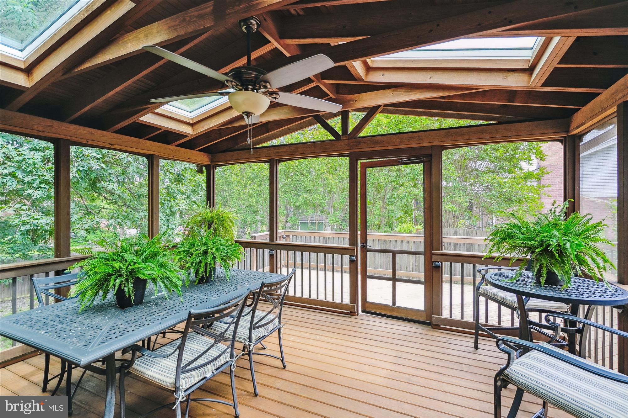 8510 Oakford Drive Springfield, VA 22152 - Photo 6 of 36 a view of a porch with furniture and wooden floor